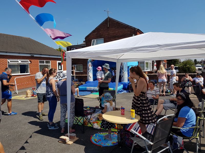 Enjoying the sunshine, bouncy castle, and BBQ